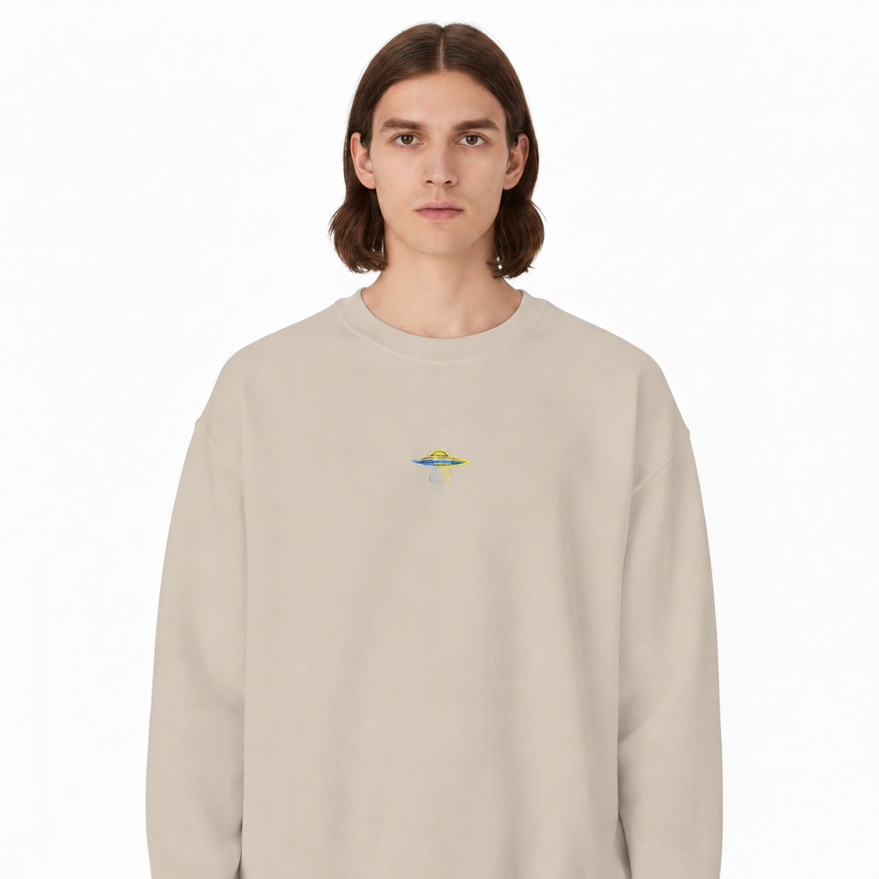 Model wearing colorful UFO embroidered at center chest on sand crewneck sweatshirt